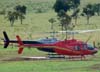 Bell 206B Jet Ranger, PT-HII, pousado na grama.