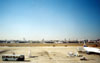Airbus A-319 da TAM decolando pela pista secundria e Boeing 737-300 da Varig estacionado no ptio. (Julho de 2000)
